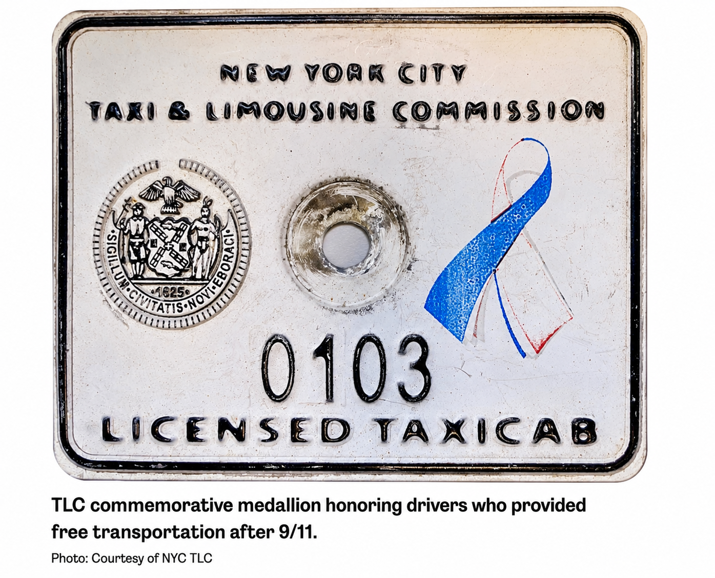NYC TLC commemorative medallion honoring taxi drivers who provided free transportation after 9/11